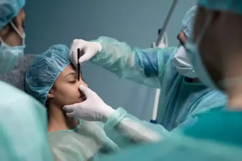 What are the risks of eyelid surgery?